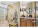 Stylish bathroom featuring a glass-enclosed shower and vanity with granite countertop at 98 Wisteria Dr, Longwood, FL 32779