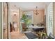 Charming bathroom showcasing a clawfoot tub, chandelier, and plantation shutters at 98 Wisteria Dr, Longwood, FL 32779