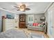 Bright bedroom with a sitting area, desk, and plenty of storage space at 98 Wisteria Dr, Longwood, FL 32779