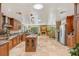 Expansive kitchen flows to living area with island, custom cabinets, and high-end appliances at 98 Wisteria Dr, Longwood, FL 32779
