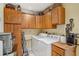 Efficient laundry room with ample cabinet space and modern appliances at 98 Wisteria Dr, Longwood, FL 32779