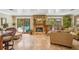 Open living area with a stone fireplace, access to pool, and comfortable seating at 98 Wisteria Dr, Longwood, FL 32779