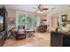 The living room features comfortable seating, a bar area, and plenty of natural light at 98 Wisteria Dr, Longwood, FL 32779