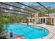 Large screened pool offering plenty of space for recreation and relaxation with a view of the rear of the home at 98 Wisteria Dr, Longwood, FL 32779