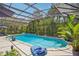 Sparkling screened pool surrounded by tropical plants and a luxurious poolside setting at 98 Wisteria Dr, Longwood, FL 32779