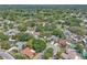 Aerial view featuring the neighborhood and a nearby pond providing serene vistas at 107 Thrush Ln, Casselberry, FL 32707