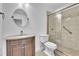 Nicely updated bathroom featuring a walk-in shower, modern fixtures, and neutral tiling at 107 Thrush Ln, Casselberry, FL 32707
