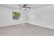 Bedroom with tile flooring, ceiling fan, and a window that provides natural light at 107 Thrush Ln, Casselberry, FL 32707