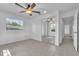 Bedroom featuring tile flooring, a ceiling fan and a mirrored closet at 107 Thrush Ln, Casselberry, FL 32707