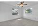 Bright bedroom featuring tile flooring, two windows and a ceiling fan at 107 Thrush Ln, Casselberry, FL 32707