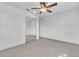 This bedroom features tile flooring, a ceiling fan and a mirrored closet at 107 Thrush Ln, Casselberry, FL 32707