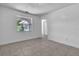 Bedroom featuring tile floors, a window, and a doorway to another room at 107 Thrush Ln, Casselberry, FL 32707