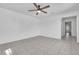 Bedroom with tile flooring, ceiling fan, and a doorway to the hallway at 107 Thrush Ln, Casselberry, FL 32707