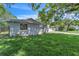 A beautifully landscaped home on a sunny day with lush green grass at 107 Thrush Ln, Casselberry, FL 32707