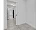 Hallway featuring tile flooring leading to the rest of the house at 107 Thrush Ln, Casselberry, FL 32707