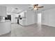 Open concept kitchen with modern appliances, tiled flooring, and updated white cabinetry at 107 Thrush Ln, Casselberry, FL 32707