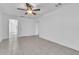 Neutral living space featuring tile floors, a ceiling fan, and white colored walls at 107 Thrush Ln, Casselberry, FL 32707