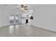 Spacious living room with tile flooring and a view of the updated kitchen at 107 Thrush Ln, Casselberry, FL 32707