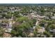 A neighborhood with a house that has a private pool amid lush green trees at 1082 Hamilton Ave, Longwood, FL 32750