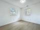 Bright bedroom features two windows that provide lots of natural light at 1082 Hamilton Ave, Longwood, FL 32750