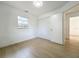 Bedroom includes a large closet, window, and bright wood-look flooring at 1082 Hamilton Ave, Longwood, FL 32750