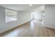 Bedroom with wood-look floors with natural light from large windows and recessed lighting at 1082 Hamilton Ave, Longwood, FL 32750