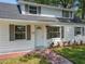 Inviting home with freshly landscaped front yard, gray shutters, and a classic white front door at 1082 Hamilton Ave, Longwood, FL 32750