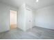 Hallway with new gray-tiled floor, a view of rooms, and access to closet space at 1082 Hamilton Ave, Longwood, FL 32750