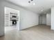 Open concept living area showcasing the kitchen with stainless appliances and white cabinetry at 1082 Hamilton Ave, Longwood, FL 32750