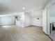 A bright and open living room features wood-look floors and recessed lighting at 1082 Hamilton Ave, Longwood, FL 32750