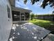 Backyard features a screened porch and a concrete patio, perfect for outdoor activities and enjoyment at 11725 Cuxham Dr, Orlando, FL 32837
