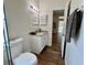 Bathroom with granite vanity and view to living area at 11725 Cuxham Dr, Orlando, FL 32837