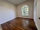 Bedroom features a vaulted window and closet with bifold doors at 11725 Cuxham Dr, Orlando, FL 32837