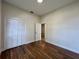Bedroom featuring wood-look floors and a closet with bifold doors at 11725 Cuxham Dr, Orlando, FL 32837