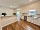 An open layout kitchen with granite countertops and views out to the patio area at 11725 Cuxham Dr, Orlando, FL 32837