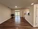 Open living area featuring wood-look floors and views of the screened-in patio at 11725 Cuxham Dr, Orlando, FL 32837