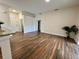 An open living space featuring modern flooring and views of the front entrance at 11725 Cuxham Dr, Orlando, FL 32837