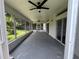 Spacious screened porch with ceiling fans and access to the backyard, ideal for outdoor living at 11725 Cuxham Dr, Orlando, FL 32837