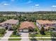 Beautiful aerial shot showcasing the home, manicured lawn, and nearby amenities at 11741 Savona Way, Orlando, FL 32827