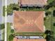 Aerial shot of a red tile roof, lush lawn, and landscaping of this beautiful property in a desirable neighborhood at 11741 Savona Way, Orlando, FL 32827