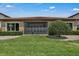 Spacious backyard featuring a screened-in porch and manicured landscaping, ideal for relaxation and entertaining at 11741 Savona Way, Orlando, FL 32827