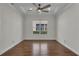 Cozy bedroom with tray ceiling and hardwood floors at 11741 Savona Way, Orlando, FL 32827