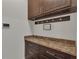 Laundry room showcasing a sink, counter space, cabinets, and modern appliances at 11741 Savona Way, Orlando, FL 32827