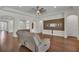 Open-concept living room featuring hardwood floors, recessed lighting, and decorative built-in shelves at 11741 Savona Way, Orlando, FL 32827