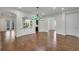 Open living area features hardwood floors and great natural light from the entryway and backyard at 11741 Savona Way, Orlando, FL 32827