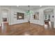 Spacious living room with hardwood floors and custom built-ins at 11741 Savona Way, Orlando, FL 32827