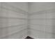Spacious pantry with sturdy metal shelving units to maximize storage capacity and organization at 11741 Savona Way, Orlando, FL 32827