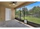 Screened-in patio providing a relaxing outdoor space with a beautiful view of the backyard at 11741 Savona Way, Orlando, FL 32827