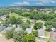 Aerial shot of residences surrounded by trees, emphasizing the natural beauty and community layout of the neighborhood at 1181 Welch Hill Cir, Apopka, FL 32712