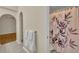 Bathroom featuring an arched doorway, tile flooring, and shower with curtain at 1181 Welch Hill Cir, Apopka, FL 32712